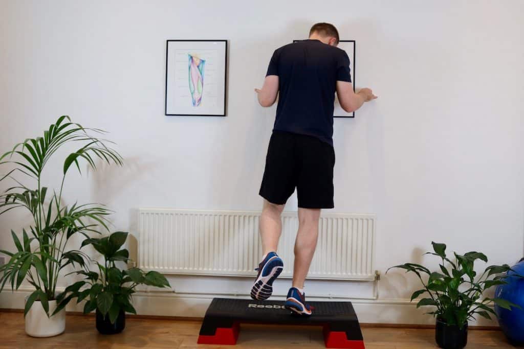 Picture of James McCormack doing a Posterior Tibialis Strengthening off a step