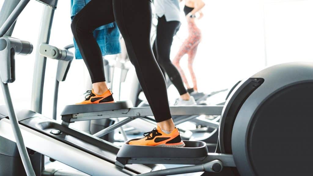 Picture of people on elliptical machines