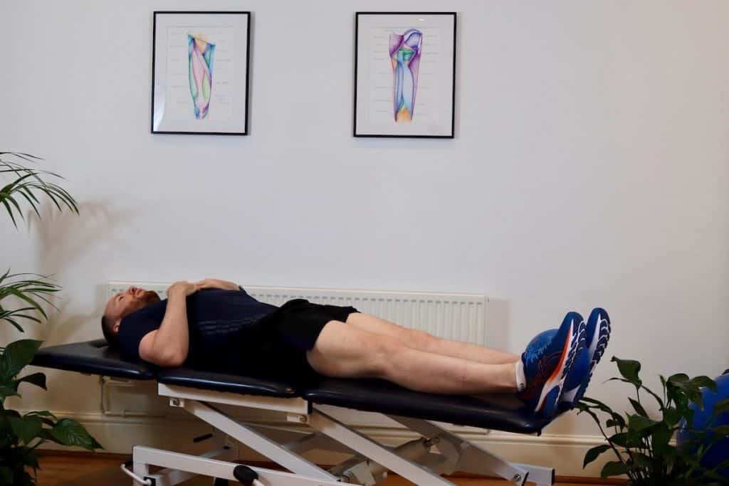 Photo of man doing adductor strengthening straight leg