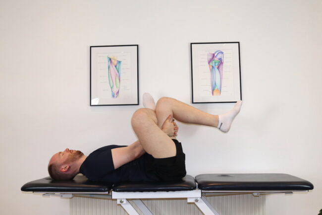 Photo of man stretching gluteals