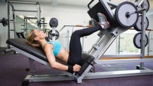 Photo of woman doing leg press for patella tendonitis