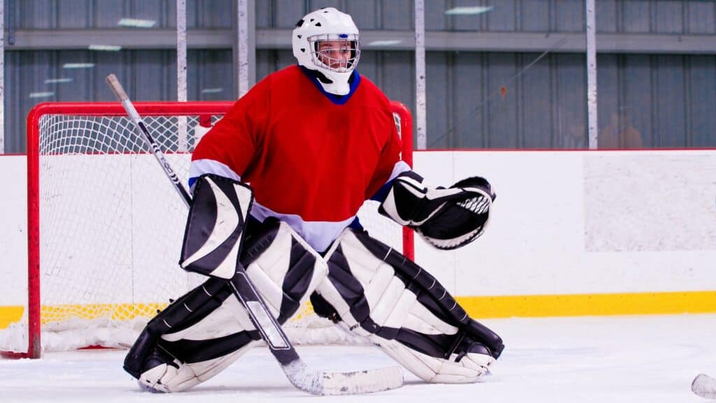 Photo of ice hockey goalie showing knee valgus a position to be avoided with Pes Anserine bursitis