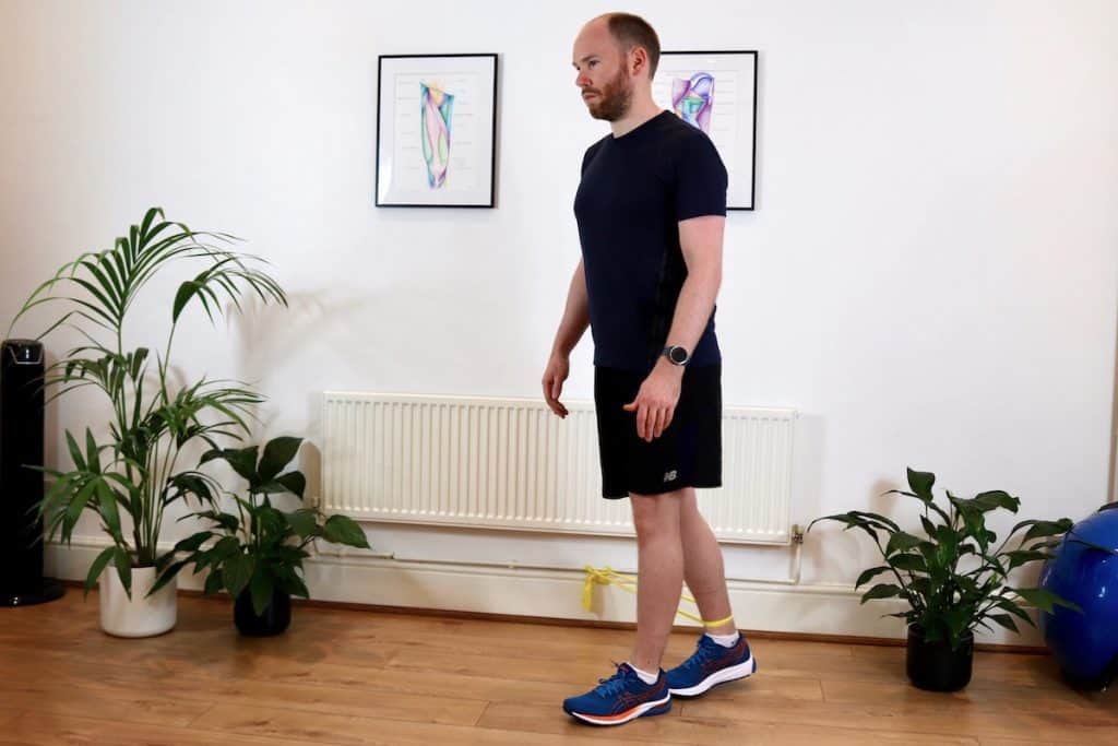 Photo of James McCormack doing hip adduction strengthening exercise