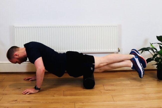 Photo of James McCormack foam rolling quadriceps