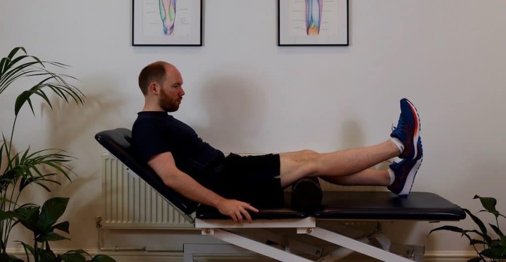 Photo of James McCormack doing inner range quadriceps exercise