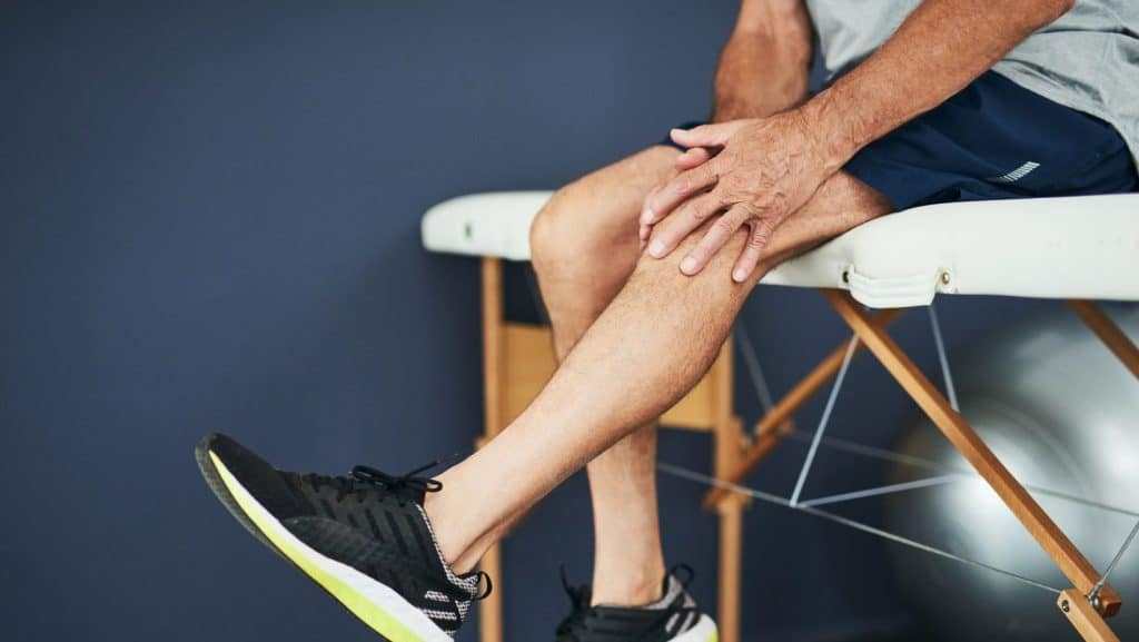 Photo of man in physical therapy for runners knee