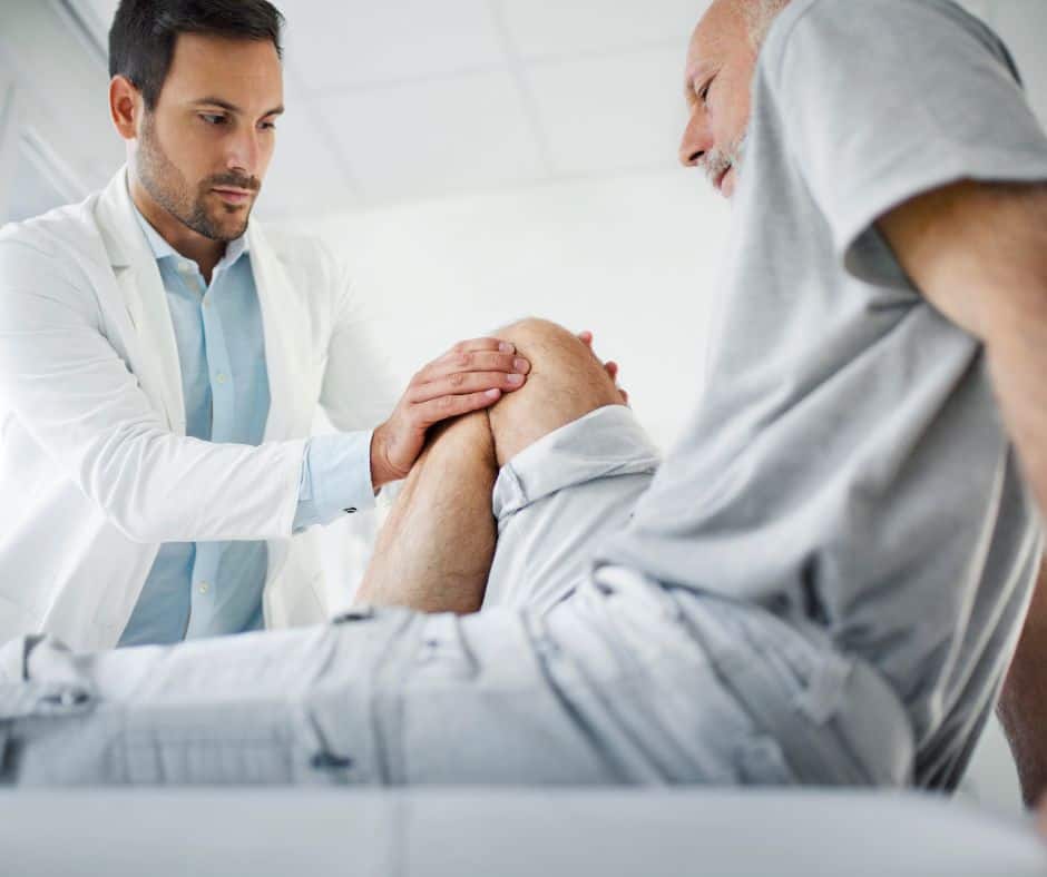 Photo of doctor examining knee