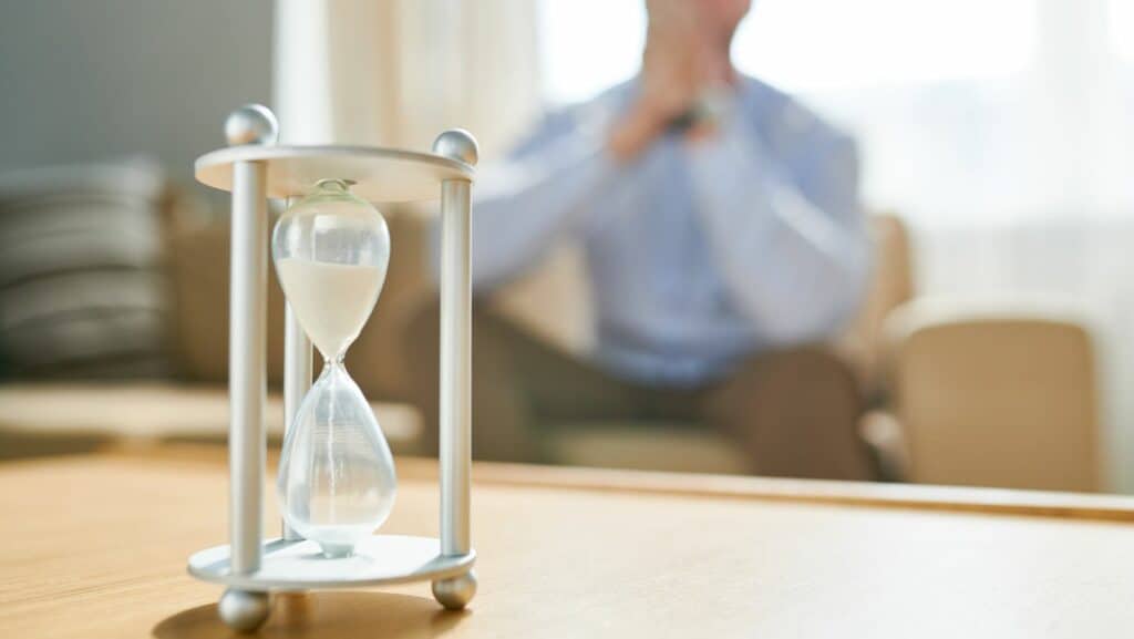 Man waiting with hour glass