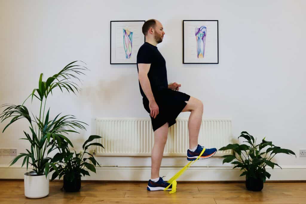 Photo of James McCormack doing hip flexor exercise with bent knee