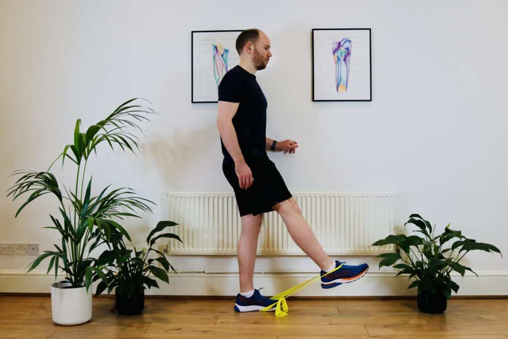 Photo of James McCormack doing hip flexor exercise with straight knee