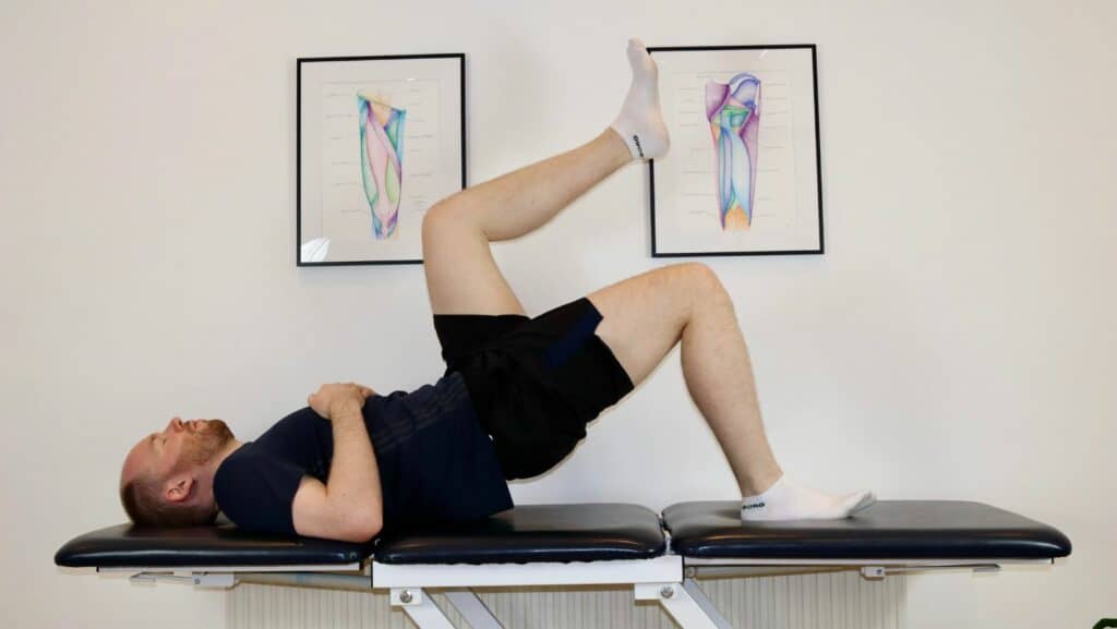 Photo of James McCormack performing glute bridge on a single leg